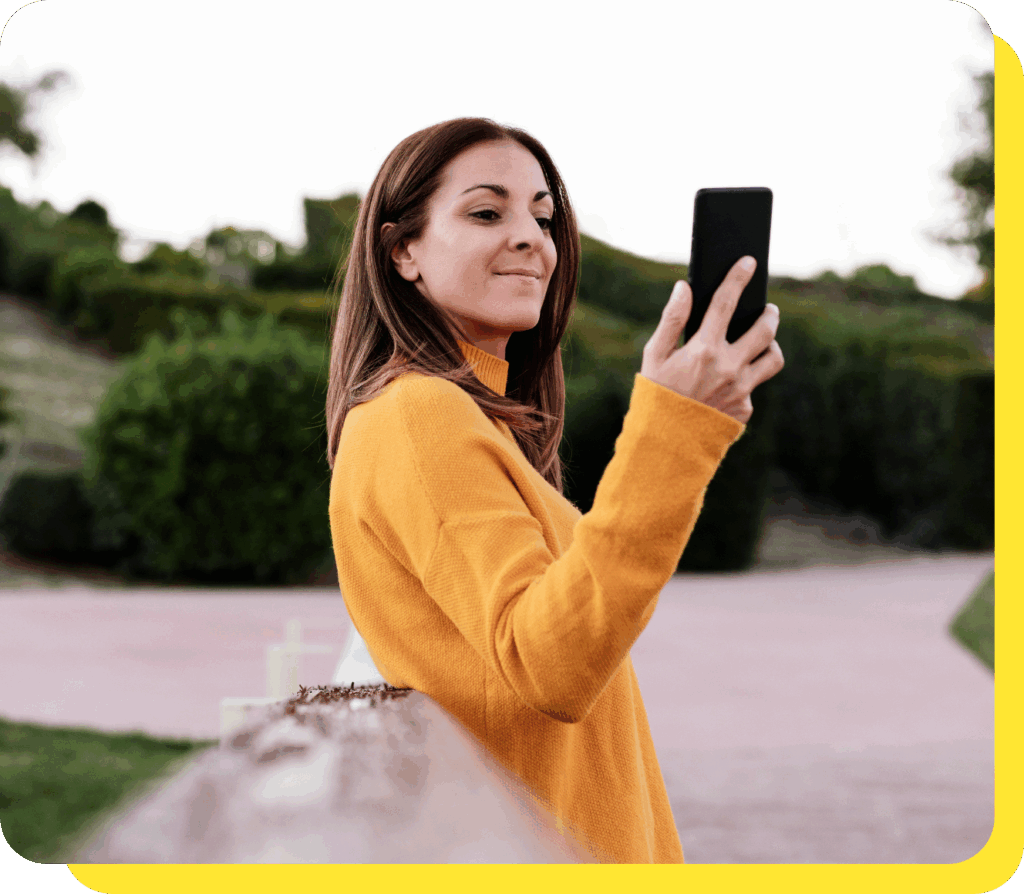 Woman happily talking on the phone, exploring serve and protect loan opportunities.