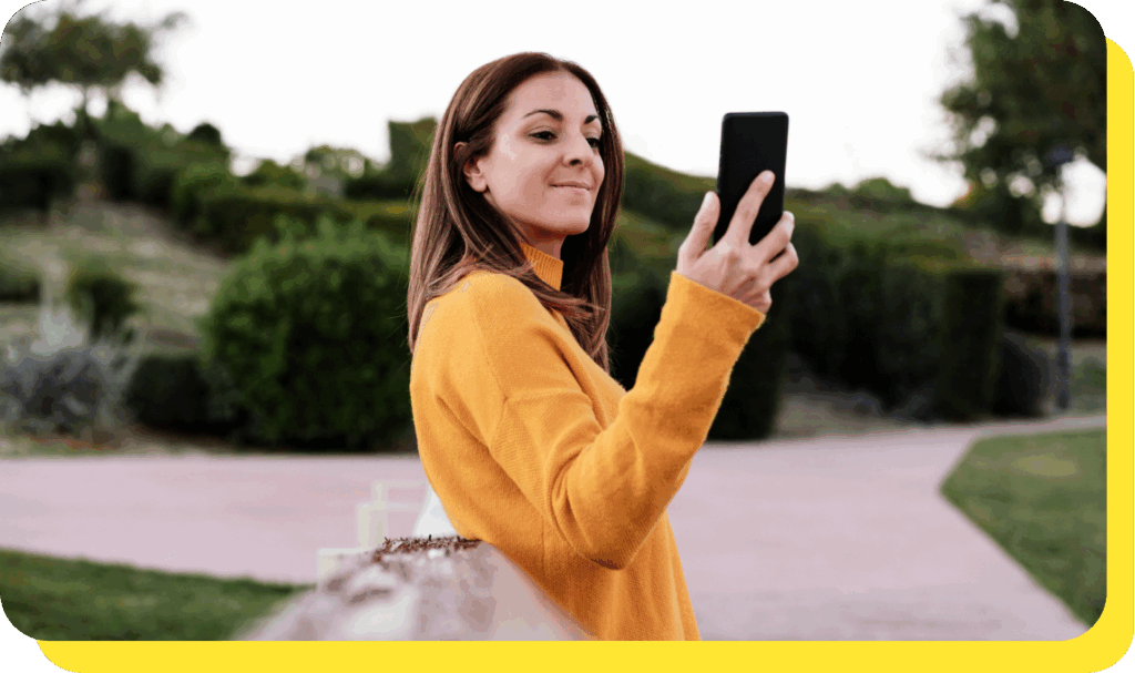 Woman happily talking on the phone, exploring serve and protect loan opportunities.
