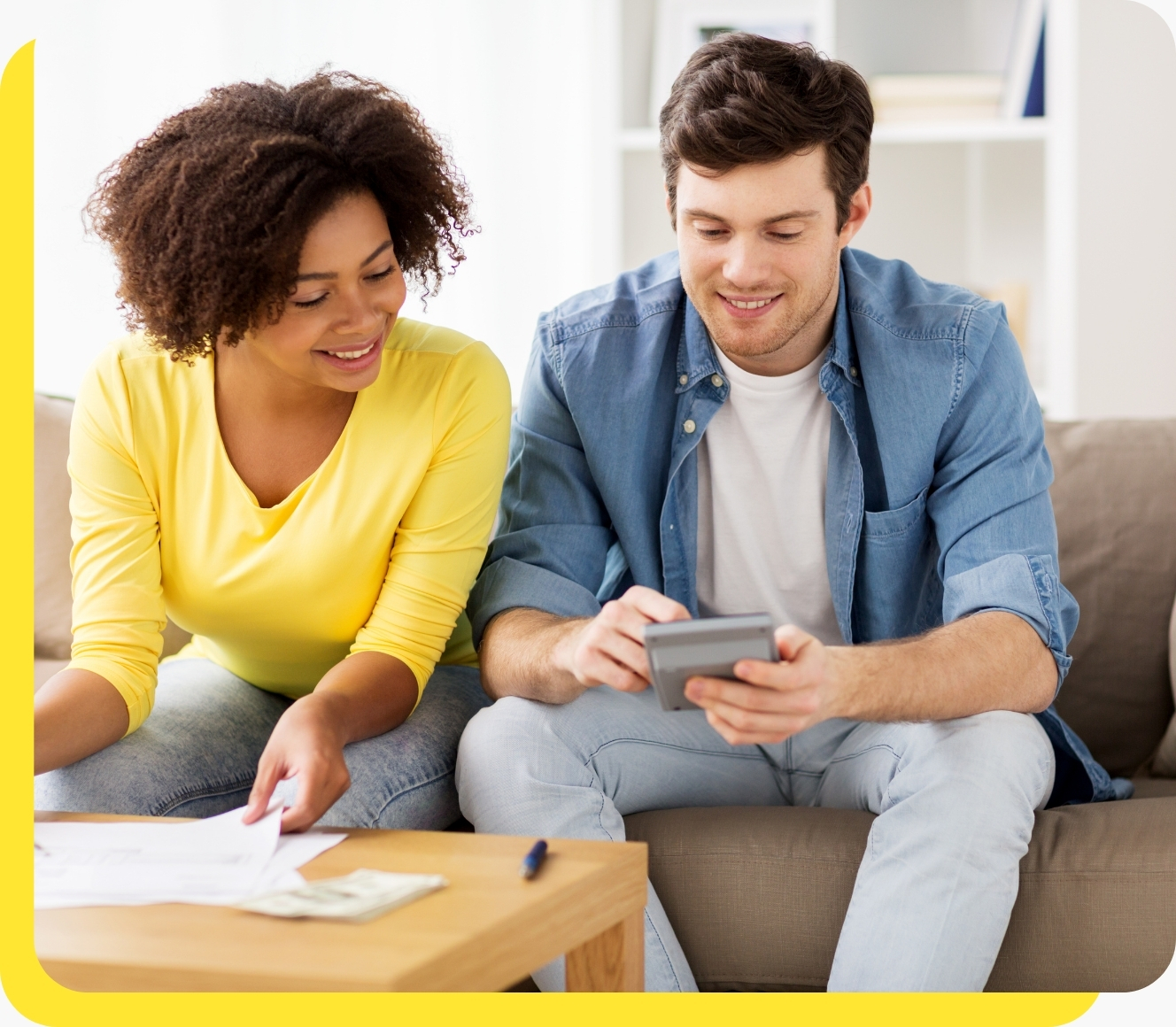 A smiling man and woman using a credit union loan calculator, highlighting the ease of planning affordable car loans with Serve and Protect.
