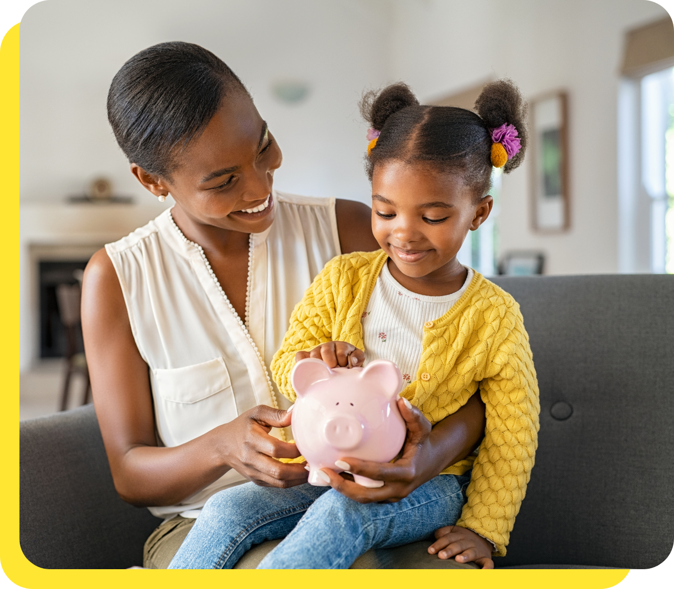 Woman and child smiling while holding a piggy bank, symbolising planning with a goal savings calculator.