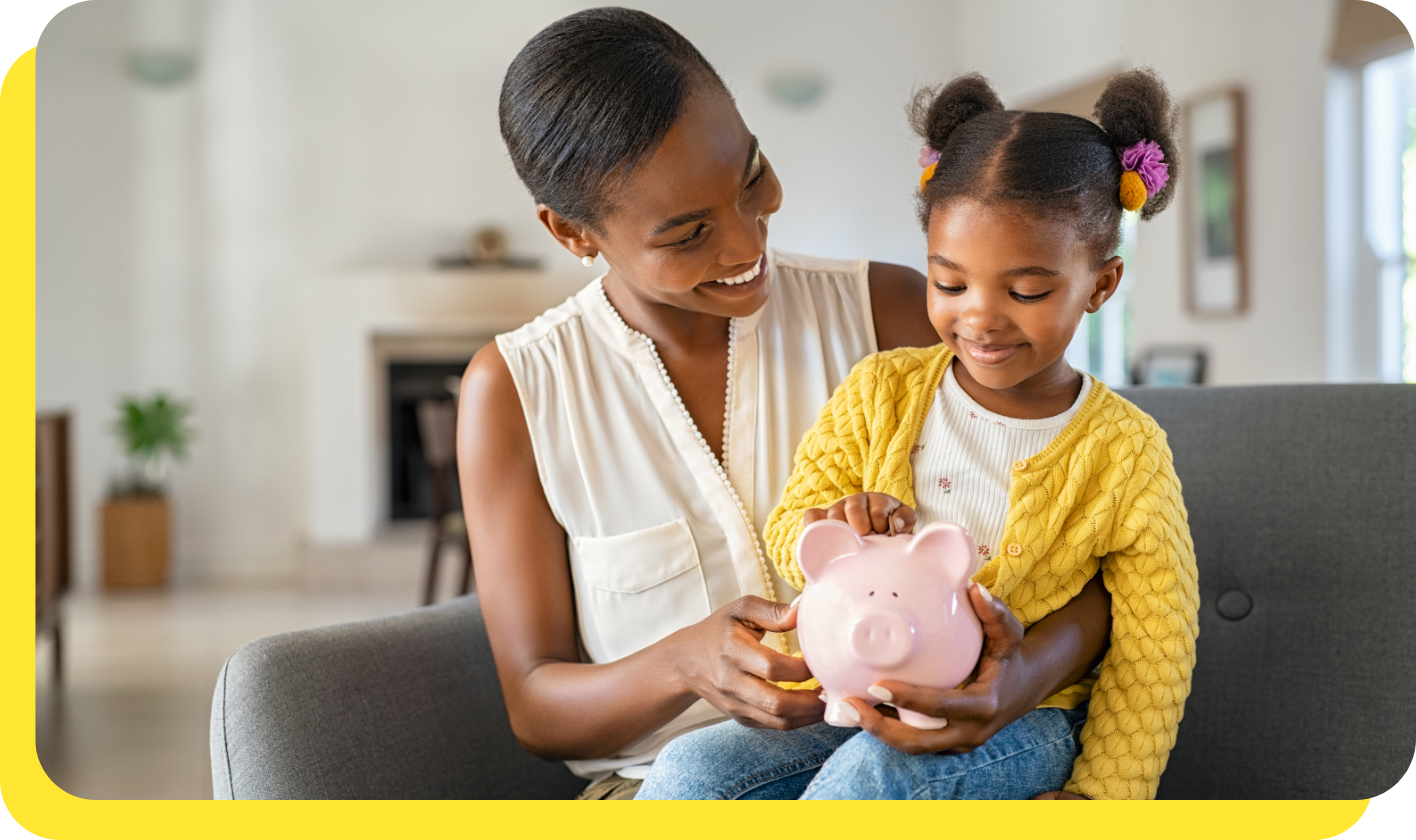 Woman and child smiling while holding a piggy bank, symbolising planning with a goal savings calculator.