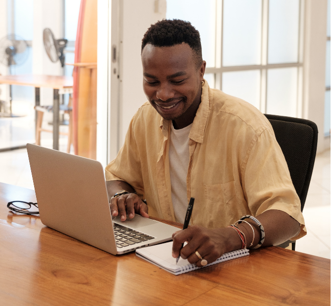 Man looking impressed while taking notes about the financial empowerment offered by Serve and Protect's open banking loans.