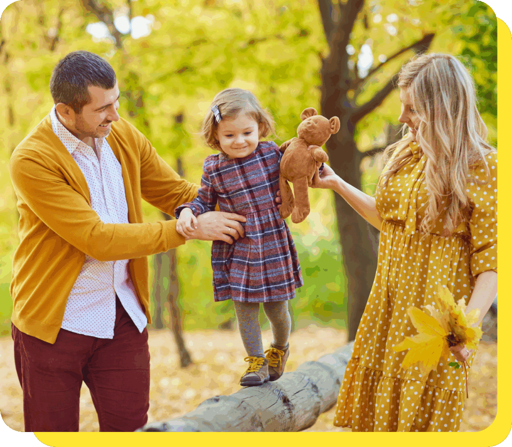 Happy family of three smiling together, representing financial security and trust as credit union members