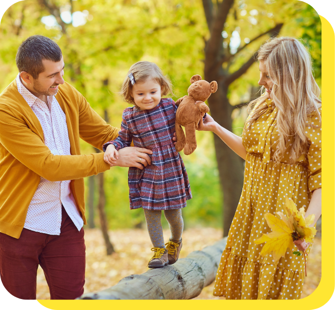A woman sitting at a desk, smiling and focused while applying for a job on her laptop in a modern, professional workspace.