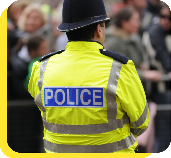 Police officer standing guard, representing our decades-long commitment to serving those who protect our communities