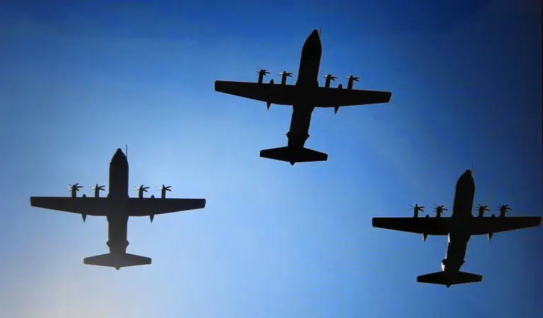 Group of Royal Air Force aeroplanes flying through a blue sky