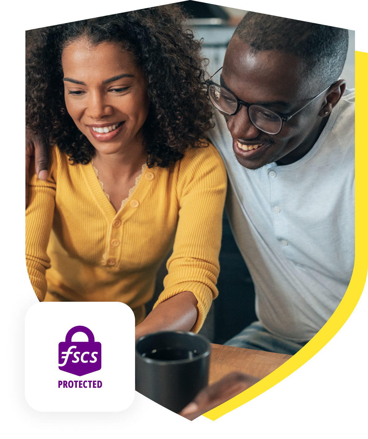 Smiling couple viewing the Serve and Protect Credit Union website together